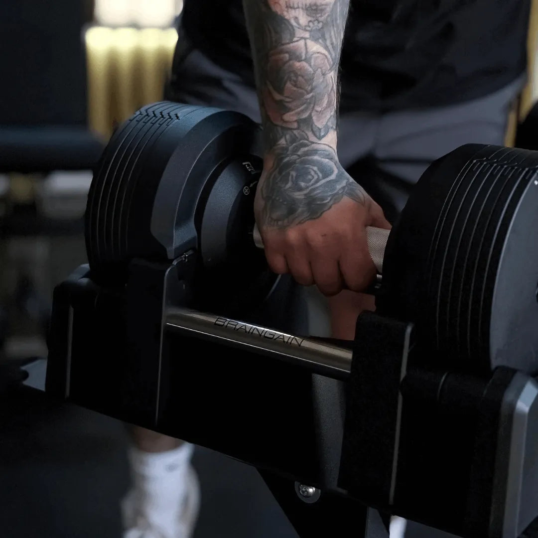 Side profile of BRAINGAIN 41.5kg black adjustable dumbbell with matte finish and cradle base