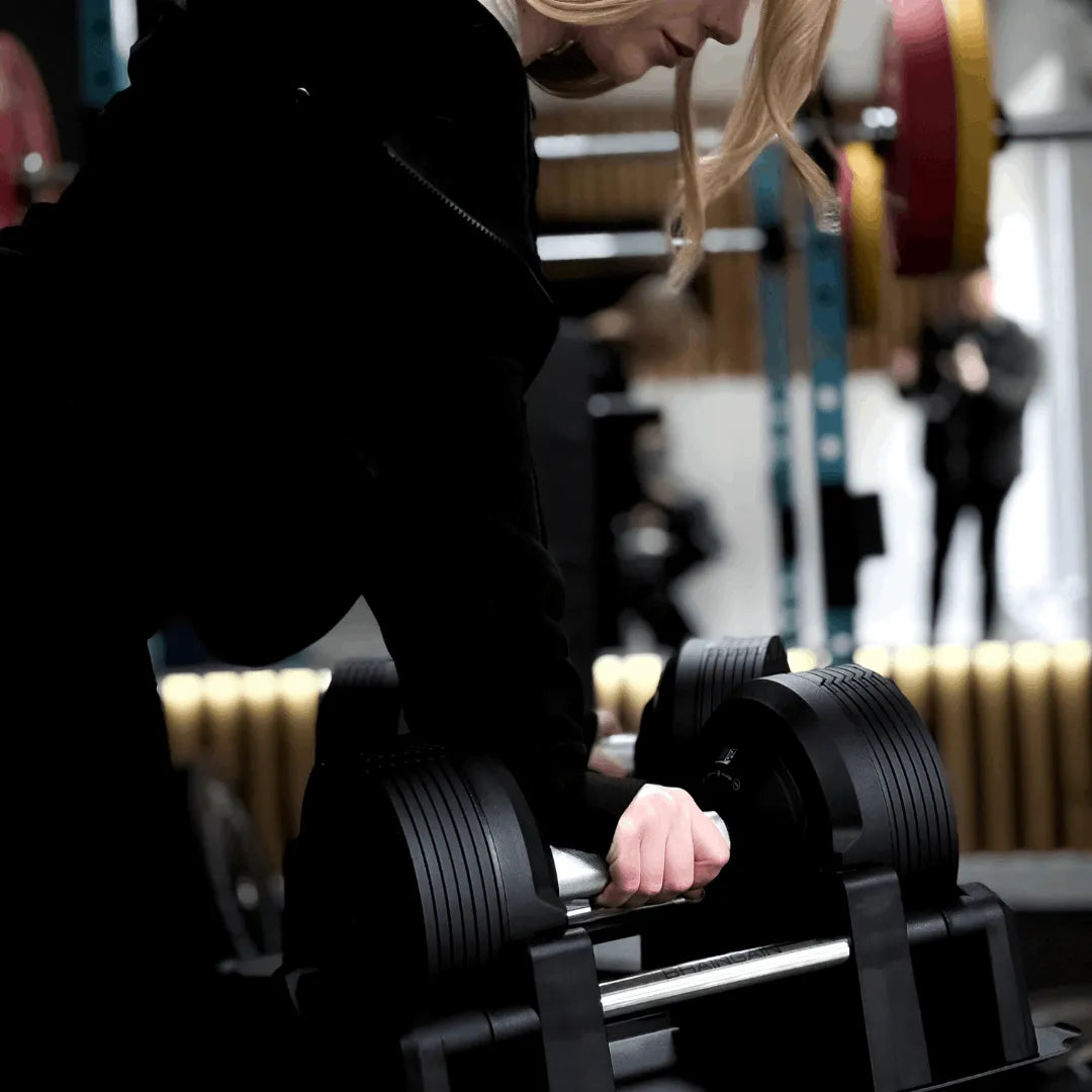 BRAINGAIN 41.5kg black adjustable dumbbell pair on professional stand for home or studio use