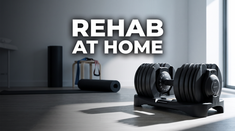 BrainGain SmartBells adjustable dumbbell in a bright home physiotherapy space with a mat and resistance band