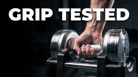 Hand gripping the knurled steel handle of a BrainGain SmartBells Pro chrome adjustable dumbbell