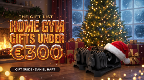 Home gym Christmas gifts under €300 – BrainGain SmartBells 24kg adjustable dumbbells under a Christmas tree with a Santa hat
